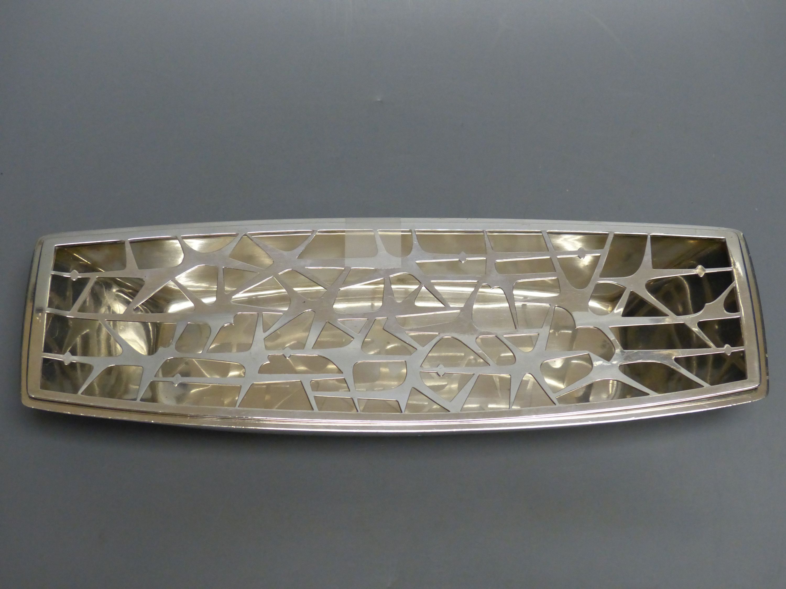 A. G. Styles for Garrard & Co, an unusual silver boat-shaped presentation flower trough, 28.94oz